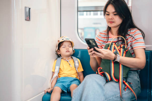 istock Asian Mother and son traveling by train 1563679394