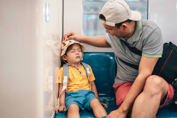 istock Asian Father and son traveling by train 1563680740