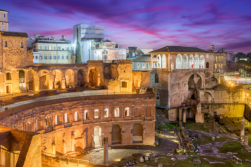 Rome, Italy overlooking Trajan's Forum at dusk.