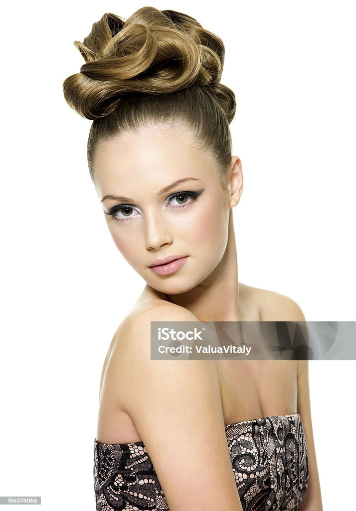 Beautiful teen girl with modern hairstyle Beautiful teen girl with curly hairstyle and bright makeup - on white background Adult Stock Photo