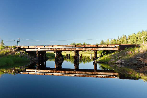 Old Rustic Wood Bridge Over River stock photo