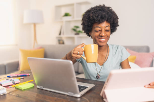 istock Young black woman on a coffee break at work 1563764008