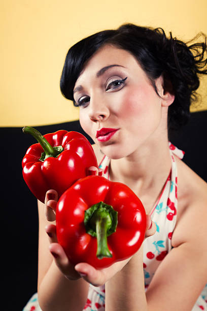 istock Woman with red peppers 156376566