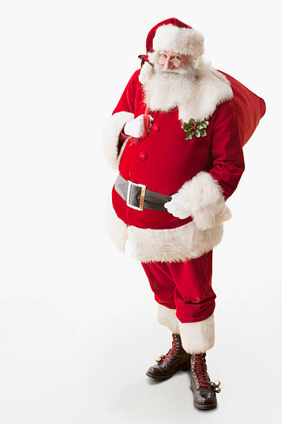 istock Smiling Santa Claus holding his gift bag isolated on white 156376995