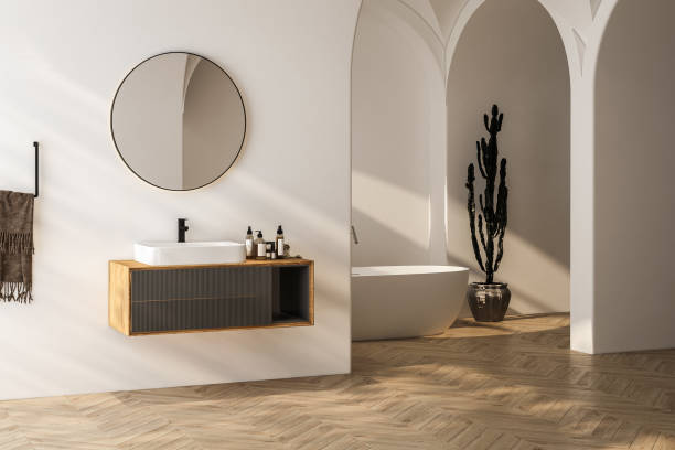 istock Bright bathroom interior with wooden vanity, bathtub, parquet floor. 3d rendering 1563772642