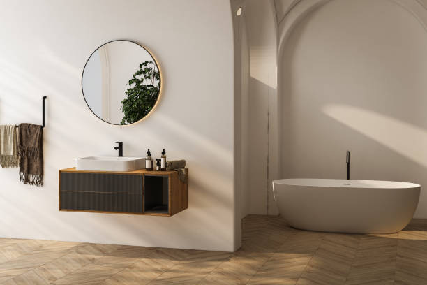 istock Bright bathroom interior with wooden vanity, bathtub, parquet floor. 3d rendering 1563774730