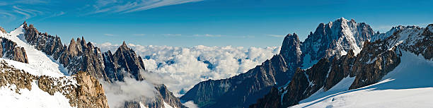 istock Alpine peaks panorama dramatic snow cloud summits Alps Italy 156378601