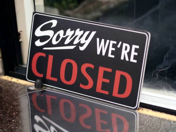 Closed out of business sign stock photo