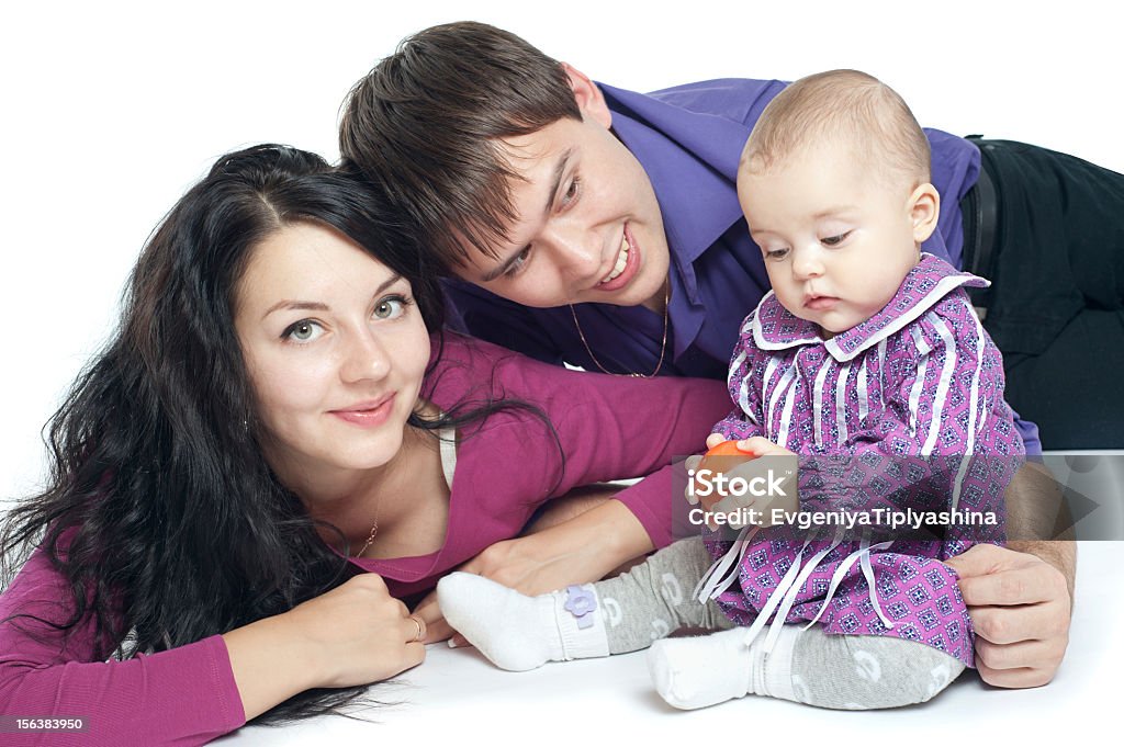 Famiglia con un bambino - Foto stock royalty-free di Adulto