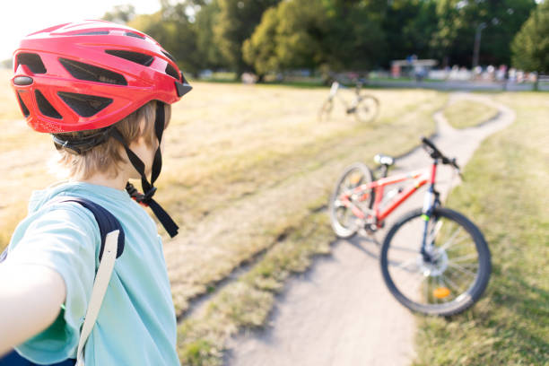 istock Young boy taking a selfie on a bike trip 1563842117