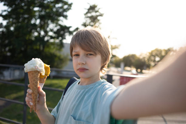 istock Young boy taking a selfie with ice-cream 1563842133