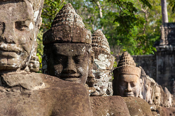 istock Giant guards of Angkor Thom front gate in Cambodia 156384819