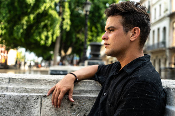 istock Young man relaxing looking away outdoors 1563859087