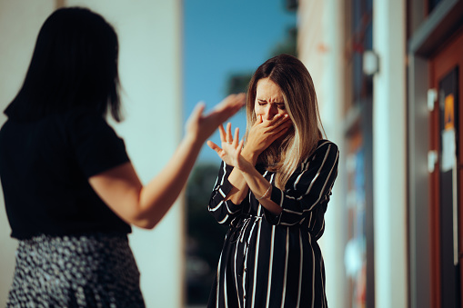 Unhappy emotional girl disagreeing with her sister