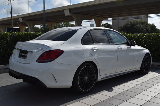 Houston, TX USA, July 21, 2023 - Rear passenger side view of a new white Mercedes-Benz coupe on sale at Sewell Mercedes in Houston