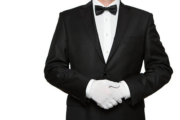 At Your service Well dressed man waiting for orders isolated on white background with copy space door attendant photos stock pictures, royalty-free photos & images
