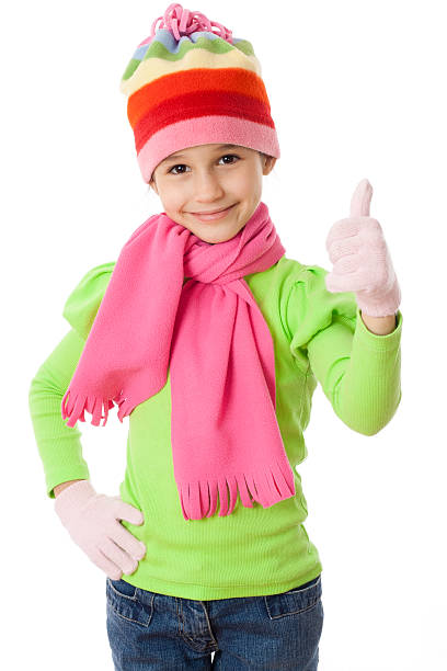 Cute girl with grey winter dress and cap