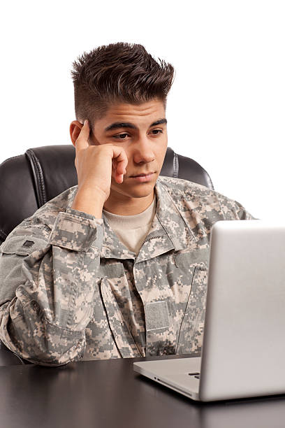 istock Soldier works on his laptop 156393062