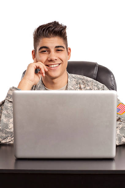 istock Cheerful soldier sits at his desk 156393091