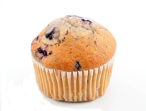 Close up of a blueberry muffin fresh Blueberry Muffin on a white background muffin stock pictures, royalty-free photos & images