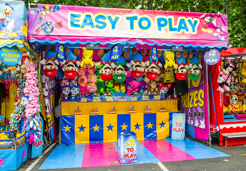 Young, New South Wales, Australia. – On December 3, 2017. – Game booth winning prizes for dolls at community fun fair.