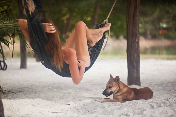 Girl sleeping in a hammock on vacation stock photo