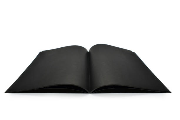 istock blank open black notebook isolated on white background, craft paper texture 1564052111
