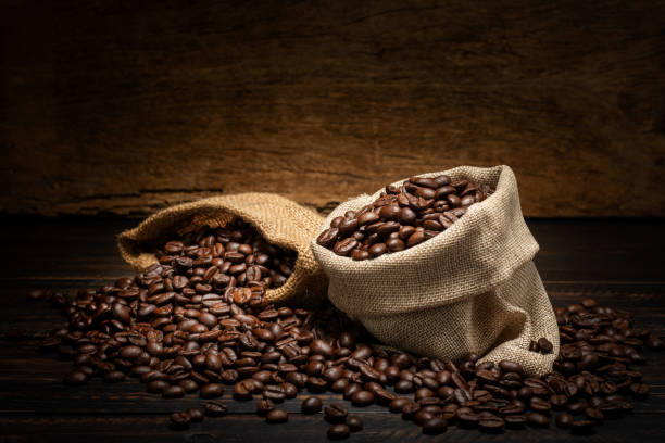istock coffee beans in sacks on wooden background 1564125394