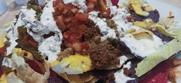 chrispy and fresh nachos on a plate