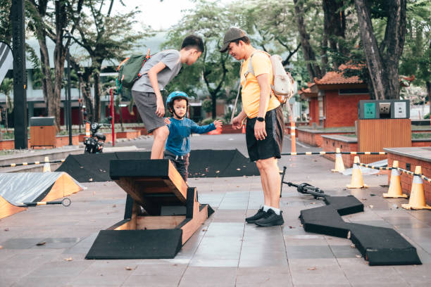 istock Asian father playing together with  his son 1564154640