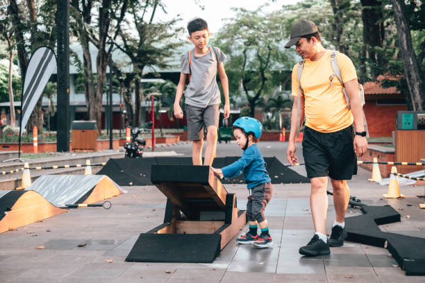 istock Asian father playing together with  his son 1564154642