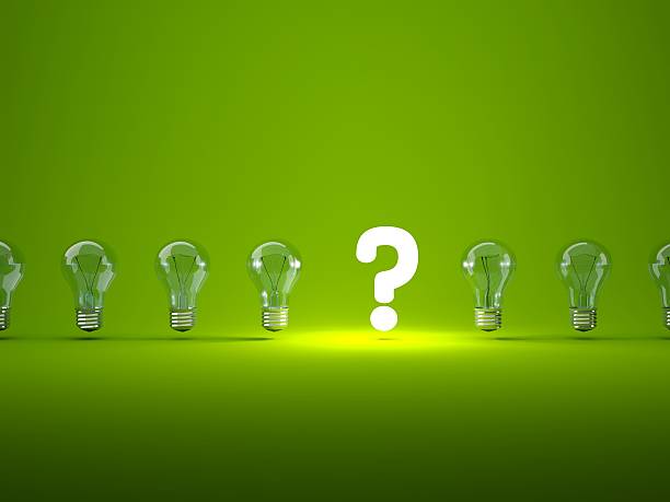 Luminous question sign with light bulbs stock photo