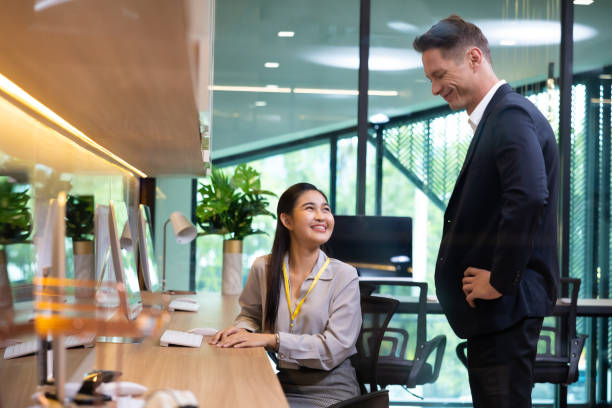 istock Business people speaker presenter consulting training. Hispanic man present explain graph strategy in sale team meeting at home office workspace 1564184870