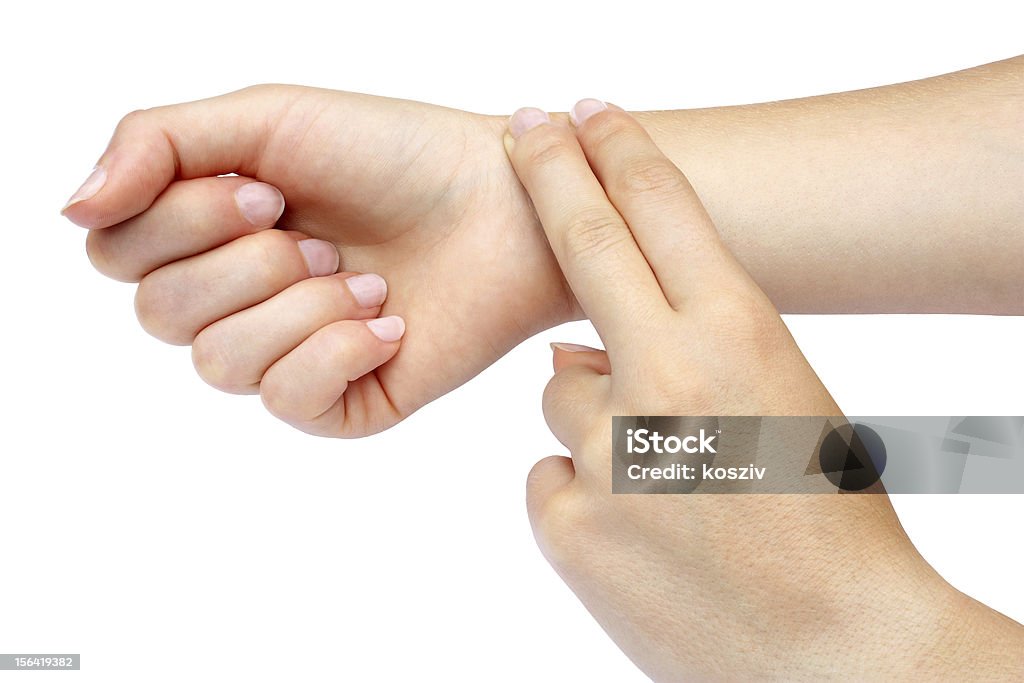 Two fingers checking pulse on wrist Female taking her own pulse Touching Stock Photo