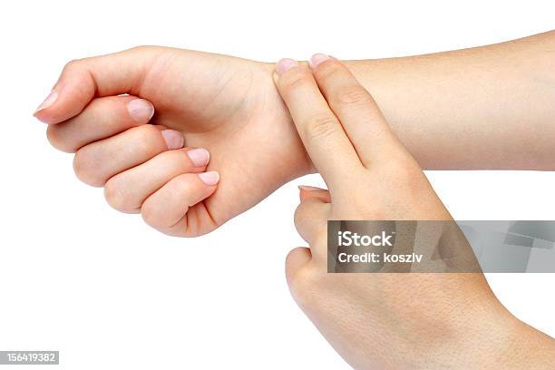 Two Fingers Checking Pulse On Wrist Stock Photo - Download Image Now - Touching, Wrist, Adult