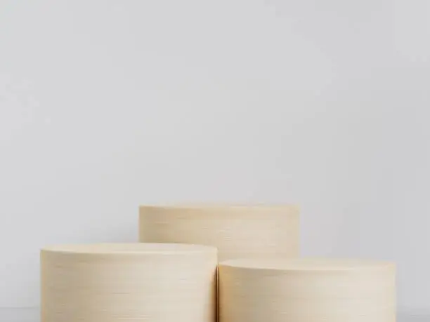 Close-up shot of  wooden tabletops in a white room under the natural sunlight