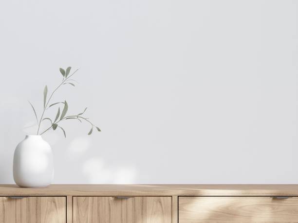 istock White vase with two wooden drawers  on a wooden surface with a white background 1564200217