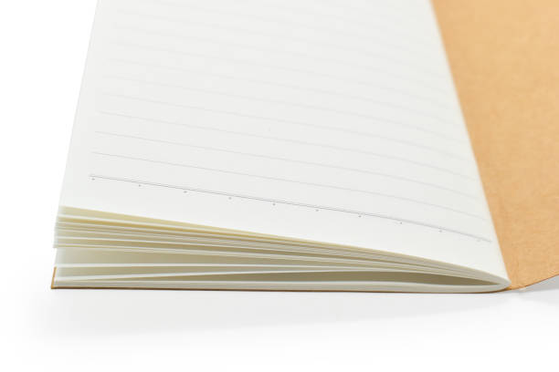 istock brown craft paper cover notebook isolated on white background, stationery for office 1564200220