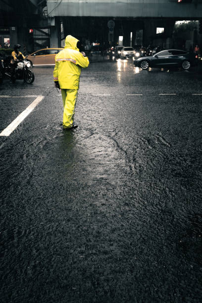istock Dutiful Traffic Warden in Heavy Rain 1564206344