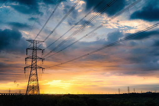 The sky and high-voltage power tower during sunset.