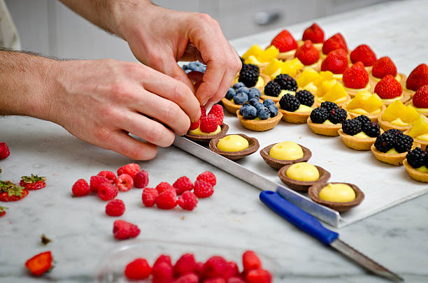 dolci di frutta - human hand baked food pineapple foto e immagini stock