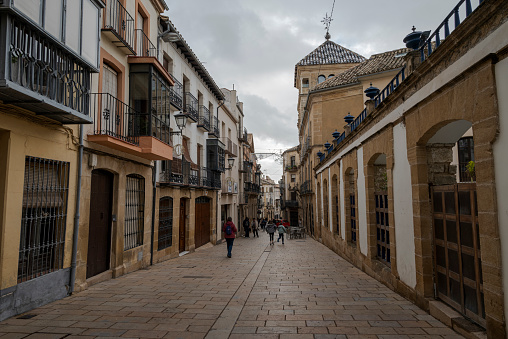 Ubeda, Spain - December 4, 2022: Street in the old town of the city of Ubeda, province of Jaen, Spain. In 2003, UNESCO declared the historic centre and landmarks of the city a World Heritage Site