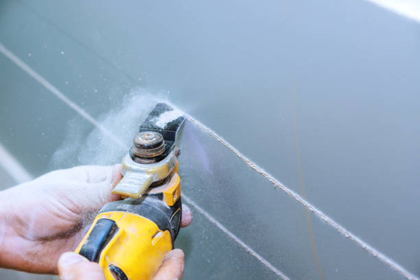 istock For purpose of installing an electric cable in wall, plasterboard was cut using a multi tool 1564252472