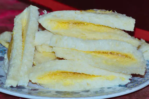 Close-up Of Homemade Snack Of White Bread With Butter And Granulated Sugar On A Plate