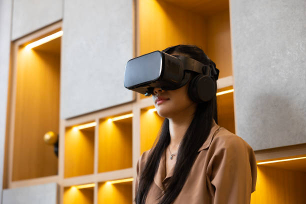 istock Asian young female using virtual reality headset. VR Glasses gadgets new technology for lifestyle 1564269692