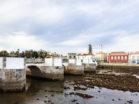 A view of Tavira and the Roman Bridge - Ponte Romana - at sunset in Spring 2023