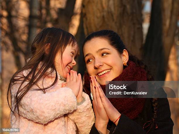 Mother And Little Girl Stock Photo - Download Image Now - Praying, Mother, Child