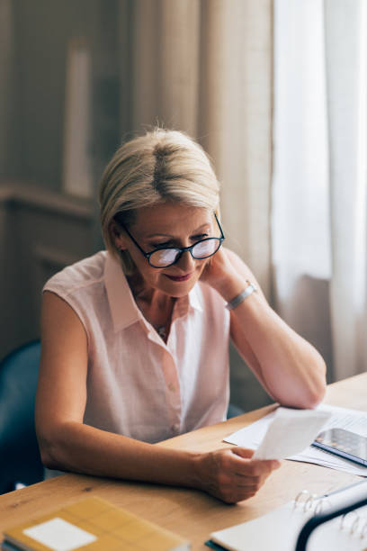 istock A Happy Beautiful Blonde Accountant With Glasses Working 1564314782