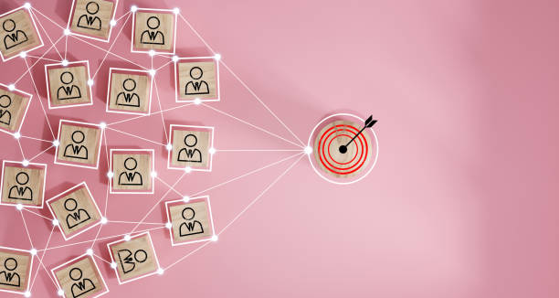 istock Red dartboard and black arrow connection linkage with human icon for customer focus target group and customer relation management concept. 1564317596