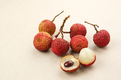 Fresh Lychee fruit and green leaf isolated on whitebackground, Top view, Flat lay.